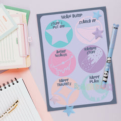 Pastel notebook cover with doodle 'Brain Dump' icons and star shapes