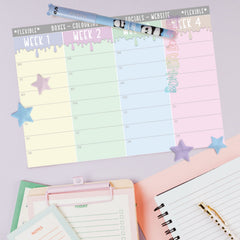 Month planner with colorful weekly grid, star accents, and notes pages